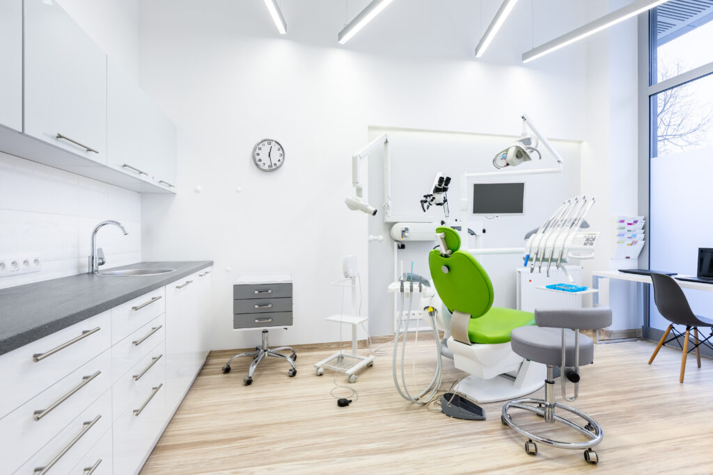 modern dentist office with green chair